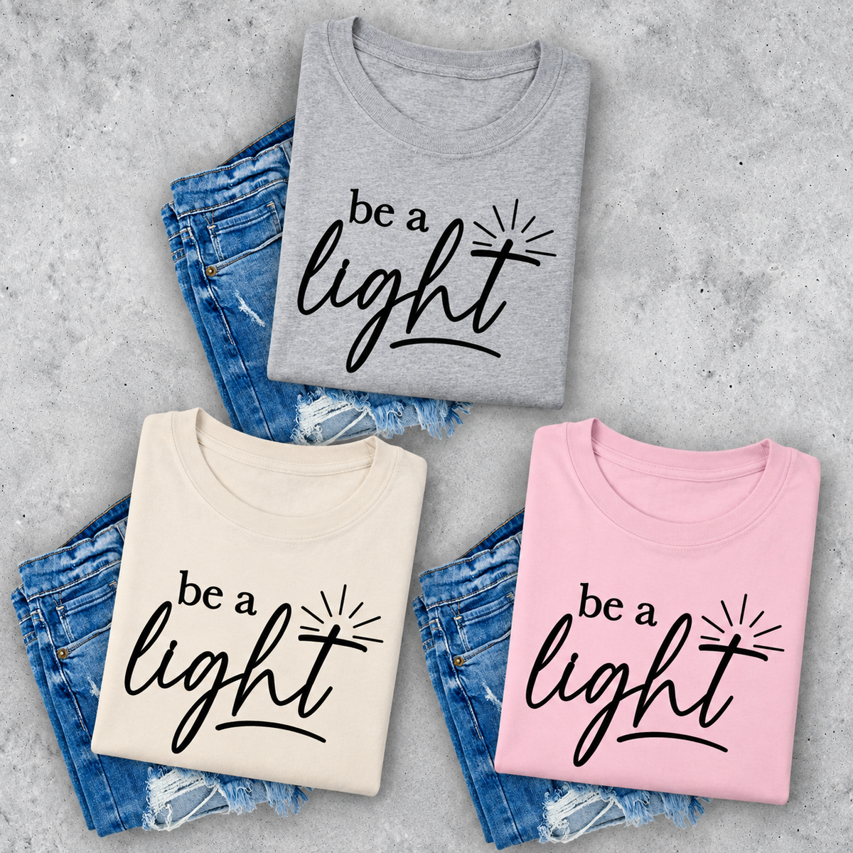 Be A Light logo fundraiser tee in sport grey, natural, and light pink