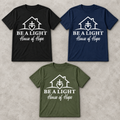 House of Hope adult fundraiser tee in black, navy, and military green